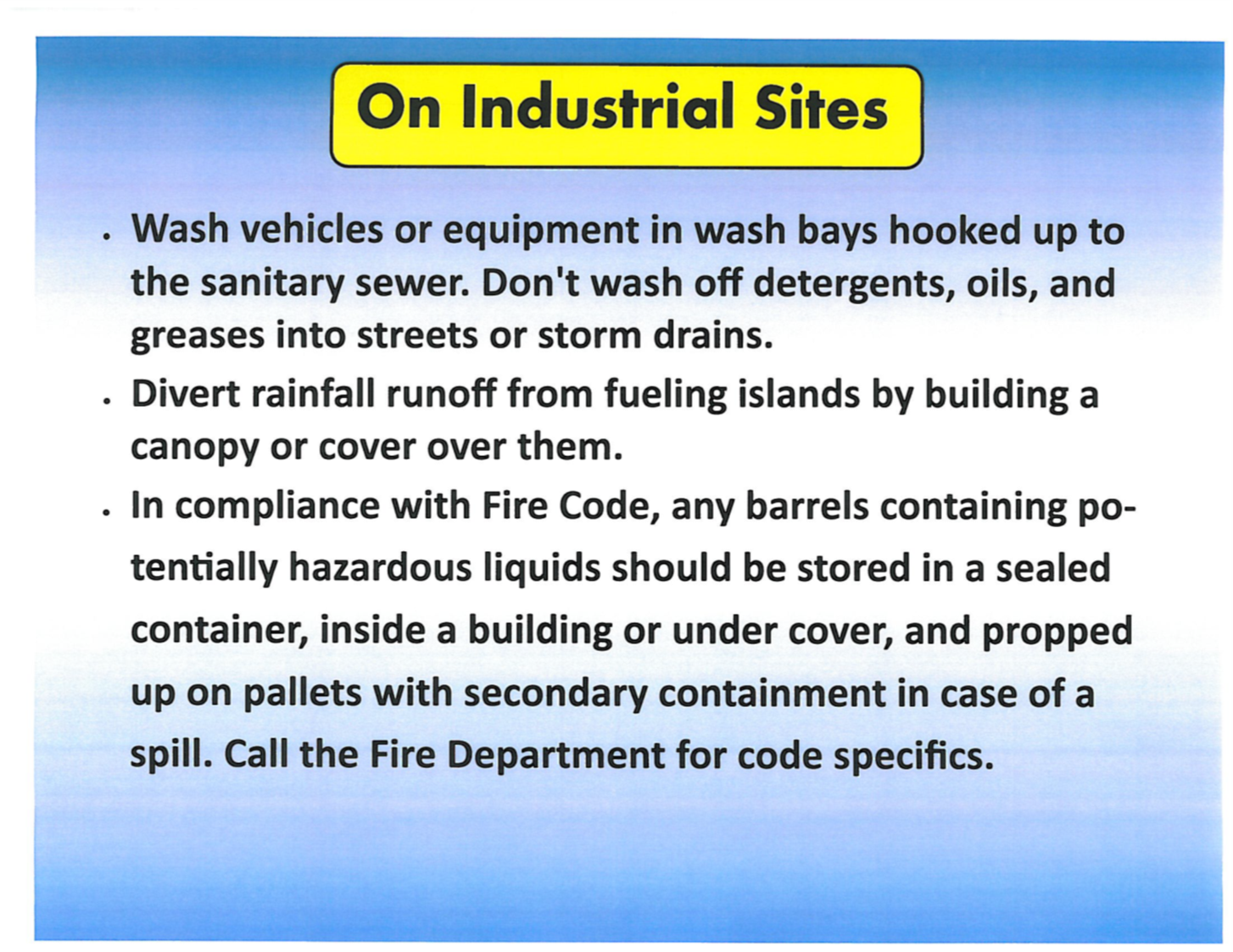 Vehicles and equipment being washed at an industrial site